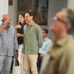 Juanma Moreno (al fondo con miembros de su equipo) y Manuel Gavira (en primer plano) coincidieron este viernes en El Rocío
